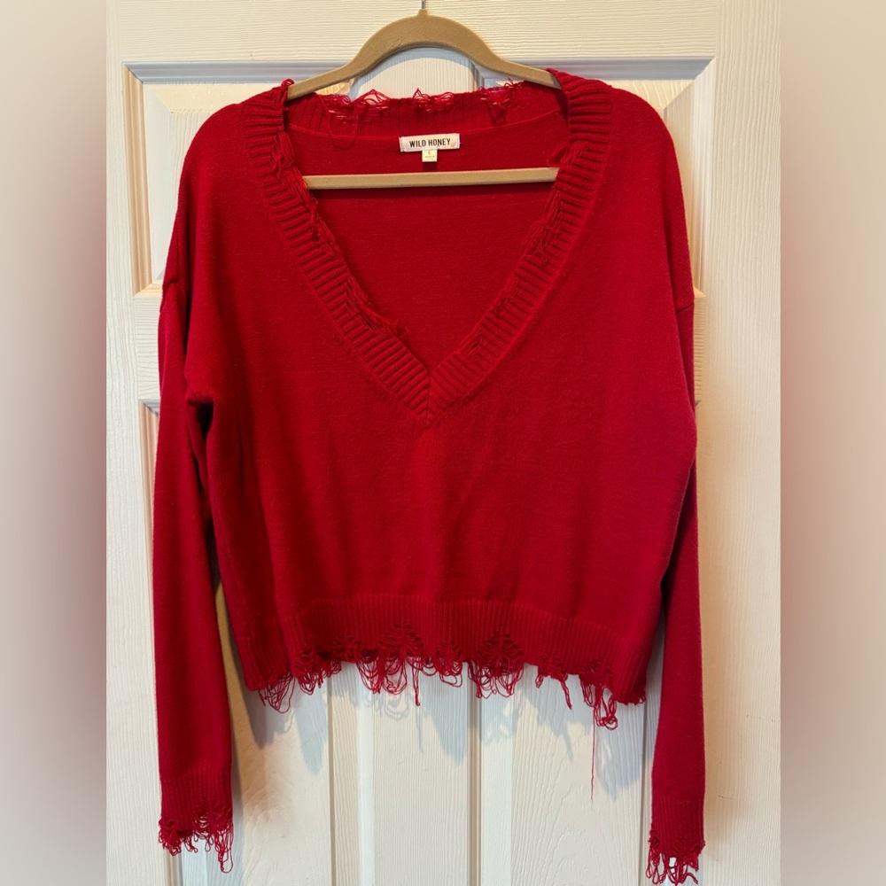 Distressed long sleeve v-neck sweater